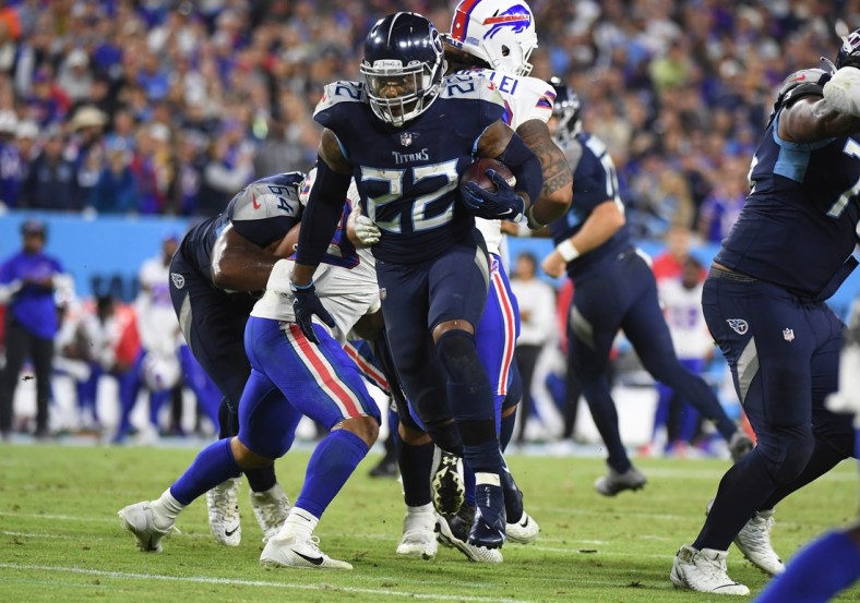Oct 18, 2021; Nashville, Tennessee, USA; Tennessee Titans running back Derrick Henry (22) runs for a touchdown during the second half against the Buffalo Bills at Nissan Stadium. Mandatory Credit: Christopher Hanewinckel-USA TODAY Sports