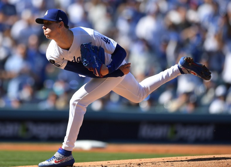 Oct 19, 2021; Los Angeles, California, USA; Los Angeles Dodgers starting pitcher Walker Buehler (21) throws during the first inning game three of the 2021 NLCS against the Atlanta Braves at Dodger Stadium. Mandatory Credit: Jayne Kamin-Oncea-USA TODAY Sports