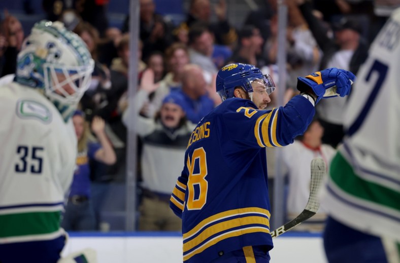 Oct 19, 2021; Buffalo, New York, USA;  Buffalo Sabres center Zemgus Girgensons (28) celebrates his goal during the second period against the Vancouver Canucks at KeyBank Center. Mandatory Credit: Timothy T. Ludwig-USA TODAY Sports