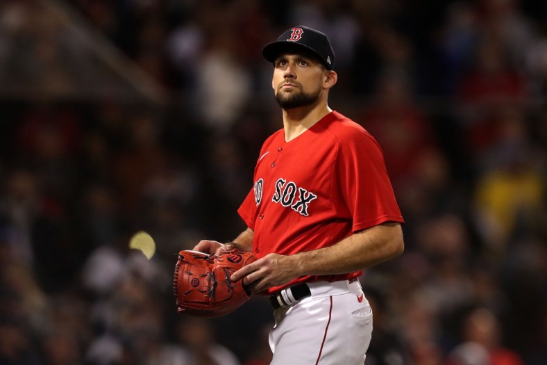 Oct 19, 2021; Boston, Massachusetts, USA; Boston Red Sox starting pitcher Nathan Eovaldi (17) walks off of the field during the ninth inning of game four of the 2021 ALCS against the Houston Astros at Fenway Park. Mandatory Credit: Paul Rutherford-USA TODAY Sports