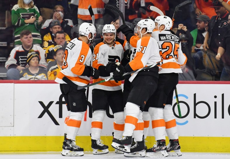 Oct 20, 2021; Philadelphia, Pennsylvania, USA; Philadelphia Flyers left wing Scott Laughton (21) celebrates with teammates after scoring a goal against the Boston Bruins during the second period at Wells Fargo Center. Mandatory Credit: Eric Hartline-USA TODAY Sports