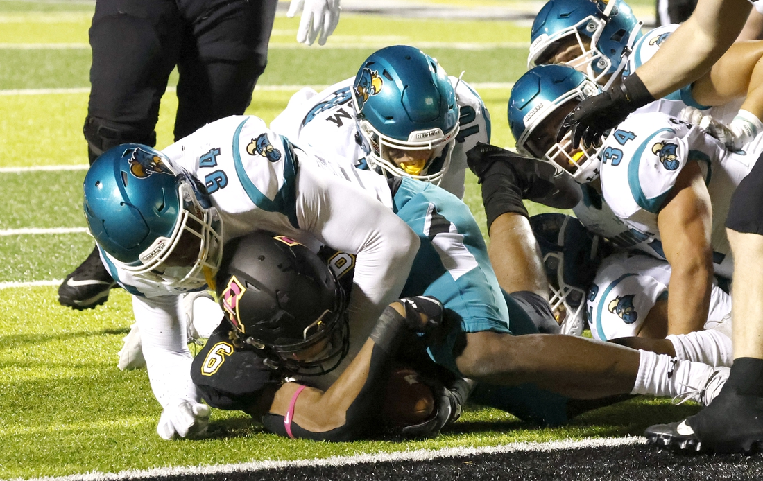 Oct 20, 2021; Boone, North Carolina, USA; Coastal Carolina Chanticleers linebacker Jeffrey Gunter (94) stops Appalachian State Mountaineers running back Camerun Peoples (6) at the one yard line during the second quarter at Kidd Brewer Stadium. Mandatory Credit: Reinhold Matay-USA TODAY Sports