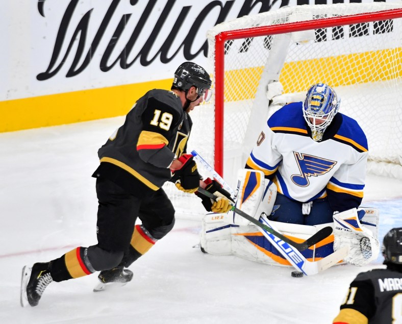Oct 20, 2021; Las Vegas, Nevada, USA; St. Louis Blues goaltender Jordan Binnington (50) makes a save against Vegas Golden Knights right wing Reilly Smith (19) during the first period at T-Mobile Arena. Mandatory Credit: Stephen R. Sylvanie-USA TODAY Sports