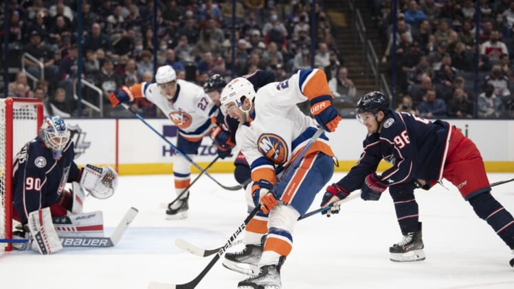Oct 21, 2021; Columbus, Ohio, USA; New York Islanders right wing Kyle Palmieri (21) shoots the puck against Columbus Blue Jackets goaltender Elvis Merzlikins (90) during the first period at Nationwide Arena. Mandatory Credit: Gaelen Morse-USA TODAY Sports