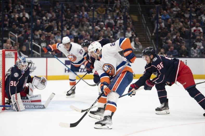 Oct 21, 2021; Columbus, Ohio, USA; New York Islanders right wing Kyle Palmieri (21) shoots the puck against Columbus Blue Jackets goaltender Elvis Merzlikins (90) during the first period at Nationwide Arena. Mandatory Credit: Gaelen Morse-USA TODAY Sports