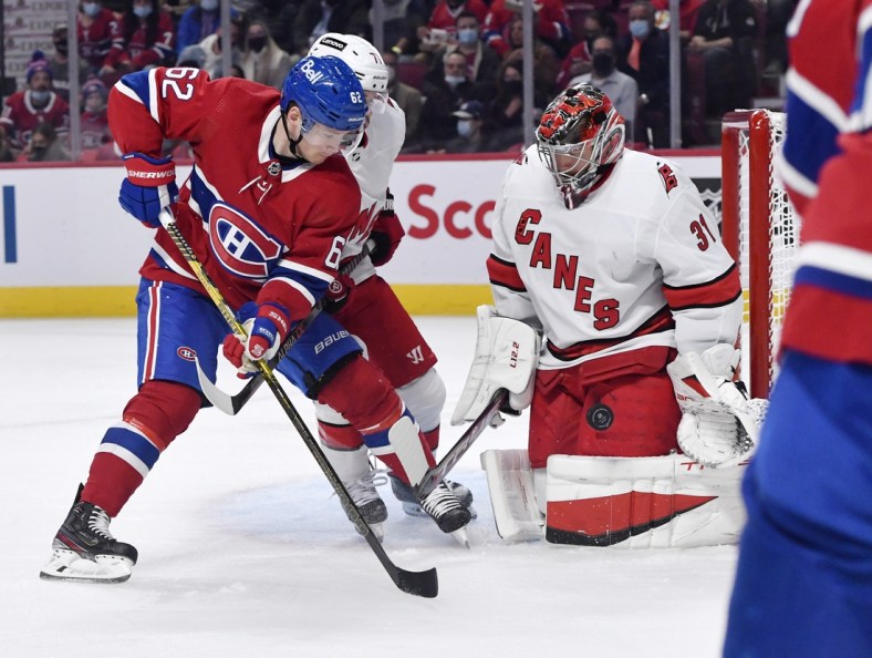 Oct 21, 2021; Montreal, Quebec, CAN; Carolina Hurricanes goalie Frederik Andersen (31) stops Montreal Canadiens forward Artturi Lehkonen (62) during the first period before at the Bell Centre. Mandatory Credit: Eric Bolte-USA TODAY Sports