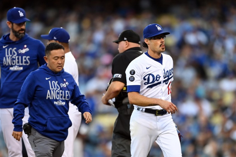 Oct 21, 2021; Los Angeles, California, USA; Los Angeles Dodgers relief pitcher Joe Kelly (17) leaves the game in the first inning against the Atlanta Braves during game five of the 2021 NLCS at Dodger Stadium. Mandatory Credit: Jayne Kamin-Oncea-USA TODAY Sports