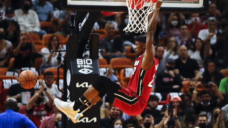 Oct 21, 2021; Miami, Florida, USA; Miami Heat forward Jimmy Butler (22) dunks the ball against the Milwaukee Bucks during the first period of the game at FTX Arena. Mandatory Credit: Sam Navarro-USA TODAY Sports