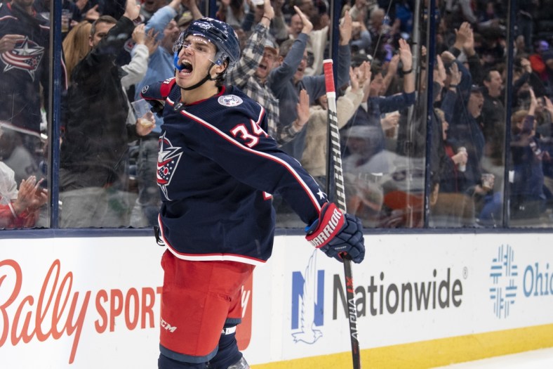 Oct 21, 2021; Columbus, Ohio, USA; Columbus Blue Jackets center Cole Sillinger (34) celebrates after scoring a goal against the New York Islanders in the second period at Nationwide Arena. Mandatory Credit: Gaelen Morse-USA TODAY Sports