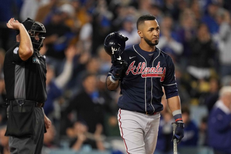 Oct 21, 2021; Los Angeles, California, USA; Atlanta Braves left fielder Eddie Rosario (8) reacts after being called out on strikes in the eighth inning against the Los Angeles Dodgers during game five of the 2021 NLCS at Dodger Stadium. Mandatory Credit: Kirby Lee-USA TODAY Sports