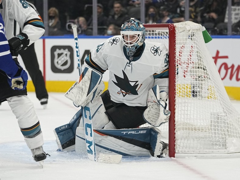 Oct 22, 2021; Toronto, Ontario, CAN; San Jose Sharks goaltender Adin Hill (33) loks for the puck against the Toronto Maple Leafs during the second period at Scotiabank Arena. Mandatory Credit: John E. Sokolowski-USA TODAY Sports