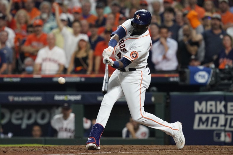 Oct 22, 2021; Houston, Texas, USA; Houston Astros designated hitter Yordan Alvarez (44) hits a triple in the sixth inning against the Boston Red Sox during game six of the 2021 ALCS at Minute Maid Park. Mandatory Credit: Thomas Shea-USA TODAY Sports