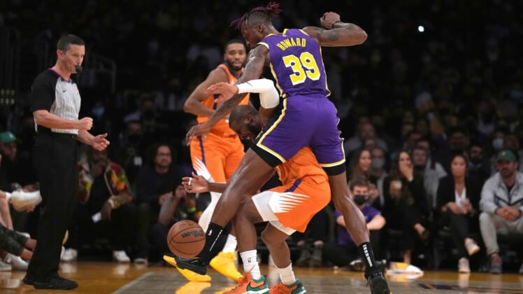Oct 22, 2021; Los Angeles, California, USA; Phoenix Suns guard Chris Paul (3) is defended by Los Angeles Lakers center Dwight Howard (39) in the first half at Staples Center. Mandatory Credit: Kirby Lee-USA TODAY Sports