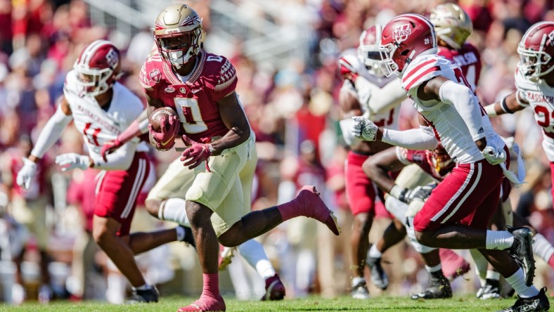 Florida State Seminoles running back Jashaun Corbin (0) looks over his shoulder as he makes his way down the field. The Florida State Seminoles leads the Massachusetts Minutemen 38-3 at the half Saturday, Oct. 23, 2021.

Fsu V Umass1421