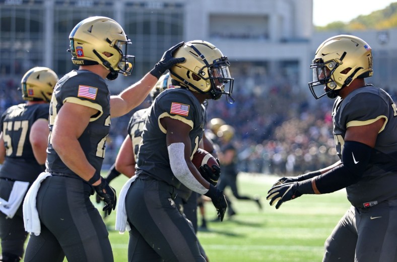 Oct 23, 2021; West Point, New York, USA; Army Black Knights running back Brandon Walters (11) celebrates after his touchdown against the Wake Forest Demon Deacons  during the first half at Michie Stadium. Mandatory Credit: Danny Wild-USA TODAY Sports