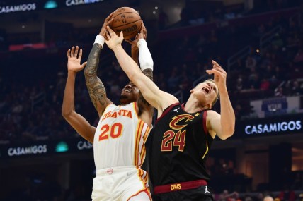 Oct 23, 2021; Cleveland, Ohio, USA; Atlanta Hawks forward John Collins (20) goes for a rebound against Cleveland Cavaliers forward Lauri Markkanen (24) during the first half at Rocket Mortgage FieldHouse. Mandatory Credit: Ken Blaze-USA TODAY Sports