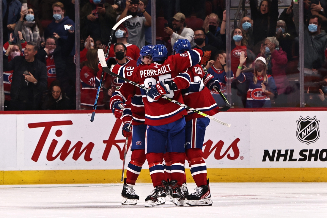 Oct 23, 2021; Montreal, Quebec, CAN; Montreal Canadiens left wing Mathieu Perreault (85) celebrates his goal against  Detroit Red Wings with teammates during the second period at Bell Centre. Mandatory Credit: Jean-Yves Ahern-USA TODAY Sports