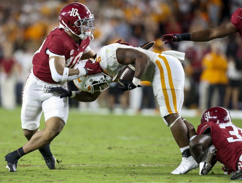 Oct 23, 2021; Tuscaloosa, Alabama, USA;  Tennessee Volunteers running back Tiyon Evans (8) is stopped by Alabama Crimson Tide linebacker Henry To'oTo'o (10) and linebacker Will Anderson Jr. (31) during the first half at Bryant-Denny Stadium. Mandatory Credit: Gary Cosby Jr.-USA TODAY Sports