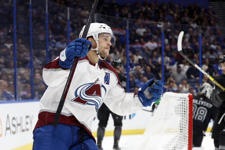 Oct 23, 2021; Tampa, Florida, USA; Colorado Avalanche center Nathan MacKinnon (29) celebrates after he scores  goal against the Tampa Bay Lightning during the second period at Amalie Arena. Mandatory Credit: Kim Klement-USA TODAY Sports