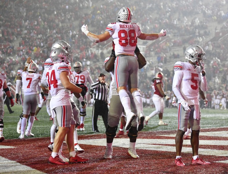 Oct 23, 2021; Bloomington, Indiana, USA; Ohio State Buckeyes tight end Jeremy Ruckert (88) is lifted to the air by a teammate  after a touchdown against the Indiana Hoosiers during the second quarter at Memorial Stadium. Mandatory Credit: Marc Lebryk-USA TODAY Sports