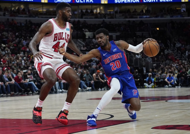 Oct 23, 2021; Chicago, Illinois, USA; Detroit Pistons guard Josh Jackson (20) drives against Chicago Bulls forward Patrick Williams (44) during the second half at United Center. Mandatory Credit: David Banks-USA TODAY Sports