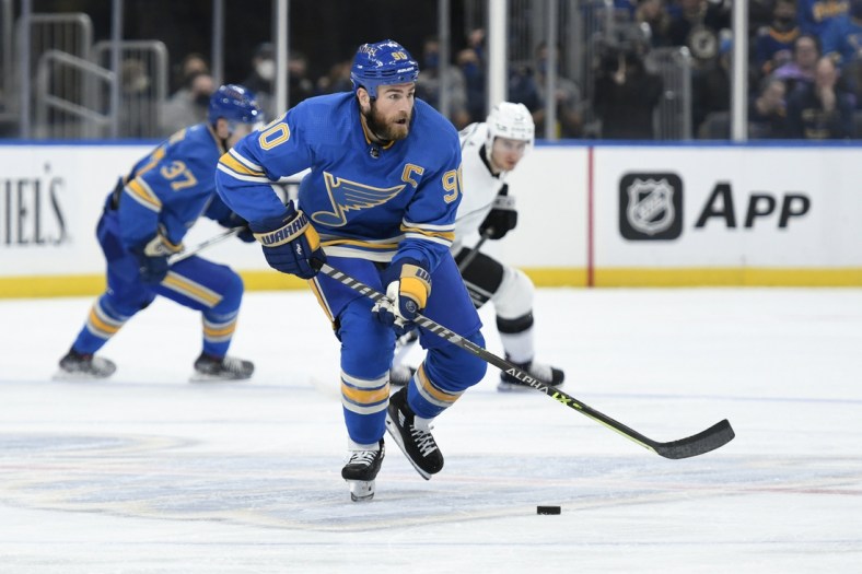 Oct 23, 2021; St. Louis, Missouri, USA; St. Louis Blues center Ryan O'Reilly (90) controls the puck against the Los Angeles Kings in the third period at Enterprise Center. Mandatory Credit: Jeff Le-USA TODAY Sports
