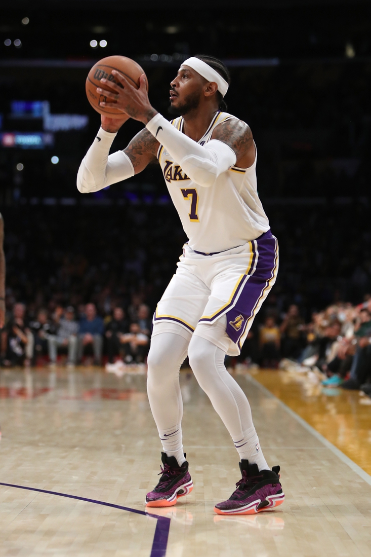 Oct 24, 2021; Los Angeles, California, USA; Los Angeles Lakers forward Carmelo Anthony (7) shoots a three-pointer during the third quarter to move into 9th place on the All-Time Scoring List during the game against the Memphis Grizzlies at Staples Center. The Lakers won 121-118. Mandatory Credit: Kiyoshi Mio-USA TODAY Sports