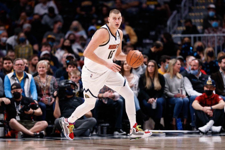 Oct 25, 2021; Denver, Colorado, USA; Denver Nuggets center Nikola Jokic (15) dribbles the ball in the second quarter against the Cleveland Cavaliers at Ball Arena. Mandatory Credit: Isaiah J. Downing-USA TODAY Sports