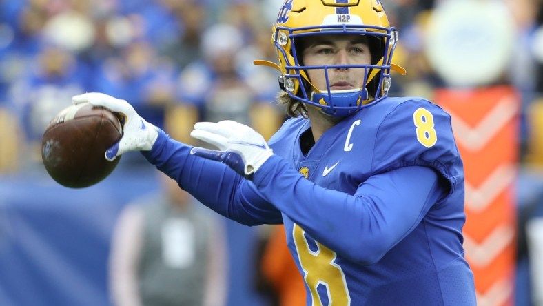 Oct 23, 2021; Pittsburgh, Pennsylvania, USA;  Pittsburgh Panthers quarterback Kenny Pickett (8) passes the ball against the Clemson Tigers during the first quarter at Heinz Field. Mandatory Credit: Charles LeClaire-USA TODAY Sports