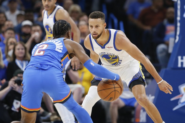 Oct 26, 2021; Oklahoma City, Oklahoma, USA; Golden State Warriors guard Stephen Curry (30) defends Oklahoma City Thunder guard Shai Gilgeous-Alexander (2) on a play during the first quarter at Paycom Center. Mandatory Credit: Alonzo Adams-USA TODAY Sports