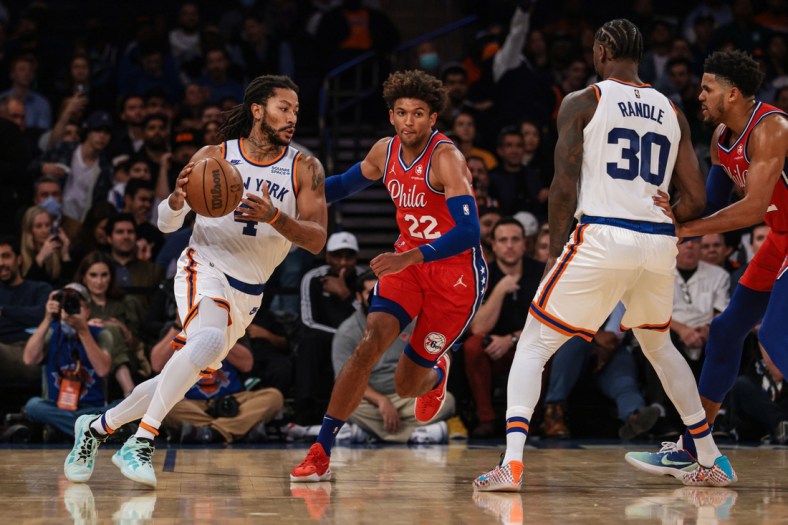 Oct 26, 2021; New York, New York, USA; New York Knicks guard Derrick Rose (4) dribbles as Philadelphia 76ers guard Matisse Thybulle (22) defends and forward Julius Randle (30) screens during the first half at Madison Square Garden. Mandatory Credit: Vincent Carchietta-USA TODAY Sports