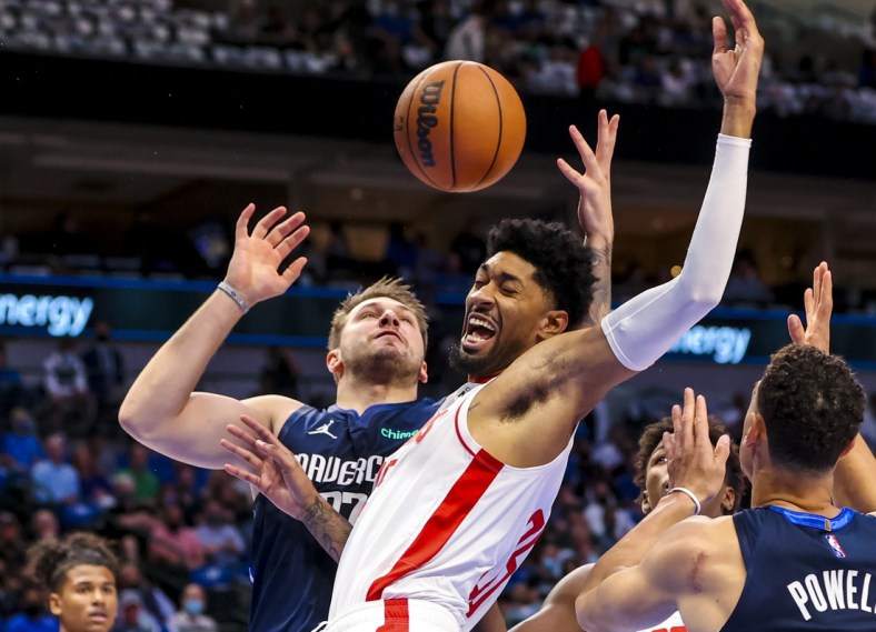 Oct 26, 2021; Dallas, Texas, USA;  Dallas Mavericks guard Luka Doncic (77) shoots as Houston Rockets center Christian Wood (35) defends during the first quarter at American Airlines Center. Mandatory Credit: Kevin Jairaj-USA TODAY Sports