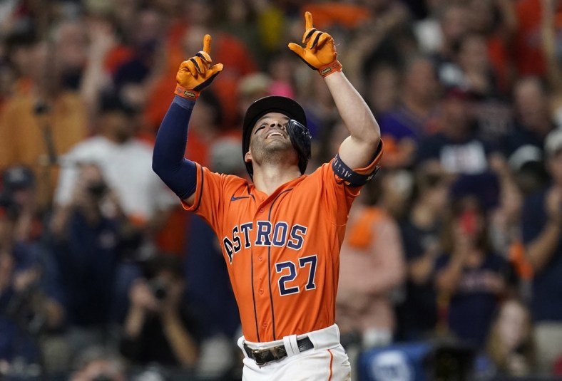Oct 27, 2021; Houston, TX, USA; Houston Astros second baseman Jose Altuve (27) celebrates after hitting a solo home run against the Atlanta Braves during the seventh inning in game two of the 2021 World Series at Minute Maid Park. Mandatory Credit: Thomas Shea-USA TODAY Sports