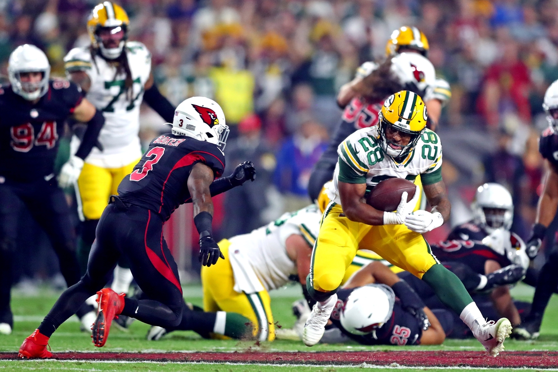 Packers' late pick sends Cardinals to first loss