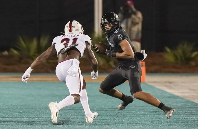 Oct 28, 2021; Conway, South Carolina, USA; Coastal Carolina Chanticleers wide receiver Jaivon Heiligh (6) catches a pass against Troy Trojans safety Dell Pettus (31) during the first half at Brooks Stadium. Mandatory Credit: David Yeazell-USA TODAY Sports