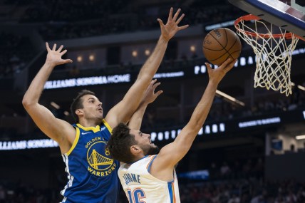 October 30, 2021; San Francisco, California, USA; Oklahoma City Thunder guard Ty Jerome (16) shoots the basketball against Golden State Warriors forward Nemanja Bjelica (8) during the first quarter at Chase Center. Mandatory Credit: Kyle Terada-USA TODAY Sports
