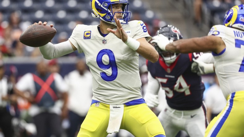 Oct 31, 2021; Houston, Texas, USA; Los Angeles Rams quarterback Matthew Stafford (9) attempts a pass during the first quarter against the Houston Texans at NRG Stadium. Mandatory Credit: Troy Taormina-USA TODAY Sports