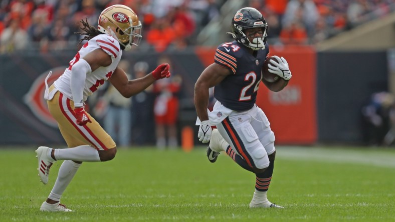 Oct 31, 2021; Chicago, Illinois, USA; Chicago Bears running back Khalil Herbert (24) runs past San Francisco 49ers cornerback Josh Norman (26) during the first half at Soldier Field. Mandatory Credit: Dennis Wierzbicki-USA TODAY Sports