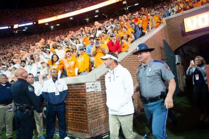 WATCH: Lane Kiffin hit by golf ball, Tennessee fans throw garbage on field