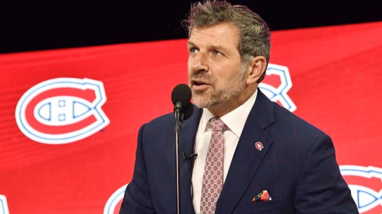 Jun 22, 2018; Dallas, TX, USA; Montreal Canadiens general manager Marc Bergevin announces the third overall pick in the first round of the 2018 NHL Draft at American Airlines Center. Mandatory Credit: Jerome Miron-USA TODAY Sports