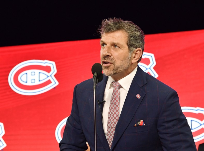 Jun 22, 2018; Dallas, TX, USA; Montreal Canadiens general manager Marc Bergevin announces the third overall pick in the first round of the 2018 NHL Draft at American Airlines Center. Mandatory Credit: Jerome Miron-USA TODAY Sports