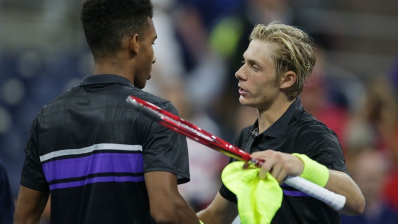 Aug 27, 2019; Flushing, NY, USA; Denis Shapovalov of Canada (right) greets Felix Auger-Aliassime of Canada (left) after a first round match on day two of the 2019 U.S. Open tennis tournament at USTA Billie Jean King National Tennis Center. Mandatory Credit: Jerry Lai-USA TODAY Sports