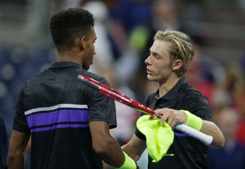 Aug 27, 2019; Flushing, NY, USA; Denis Shapovalov of Canada (right) greets Felix Auger-Aliassime of Canada (left) after a first round match on day two of the 2019 U.S. Open tennis tournament at USTA Billie Jean King National Tennis Center. Mandatory Credit: Jerry Lai-USA TODAY Sports