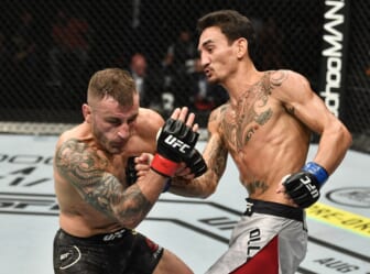Feb 15, 2020; Rio Rancho, New Mexico, USA; Diego Sanchez (red) fights Michel Pereira (blue) in the welterweight bout during UFC Fight Night at Santa Ana Star Arena. Mandatory Credit: Kirby Lee-USA TODAY Sports