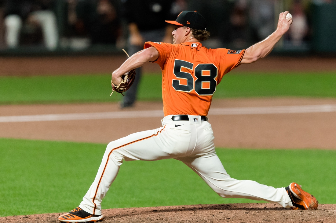 Aug 14, 2020; San Francisco, California, USA; San Francisco Giants relief pitcher Trevor Gott (58) throws against the Oakland Athletics in the ninth inning at Oracle Park. Mandatory Credit: John Hefti-USA TODAY Sports