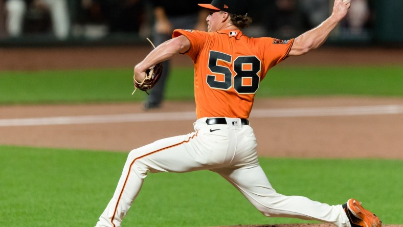 Aug 14, 2020; San Francisco, California, USA; San Francisco Giants relief pitcher Trevor Gott (58) throws against the Oakland Athletics in the ninth inning at Oracle Park. Mandatory Credit: John Hefti-USA TODAY Sports