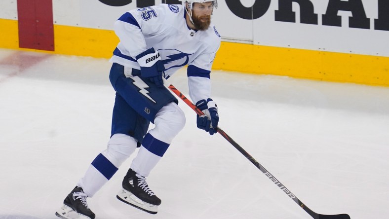 Aug 29, 2020; Toronto, Ontario, CAN; Tampa Bay Lightning defenseman Braydon Coburn (55) carries the puck against teh Boston Bruins in game four of the second round of the 2020 Stanley Cup Playoffs at Scotiabank Arena. Mandatory Credit: John E. Sokolowski-USA TODAY Sports