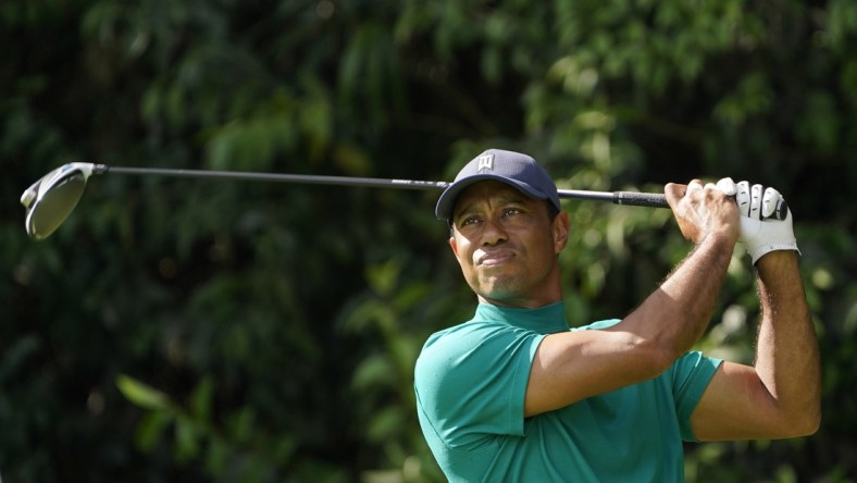 Nov 9, 2020; Augusta, Georgia, USA; Tiger Woods watch his hits his tee shot on the 14th hole during a practice round for The Masters golf tournament at Augusta National GC. Mandatory Credit: Michael Madrid-USA TODAY Sports