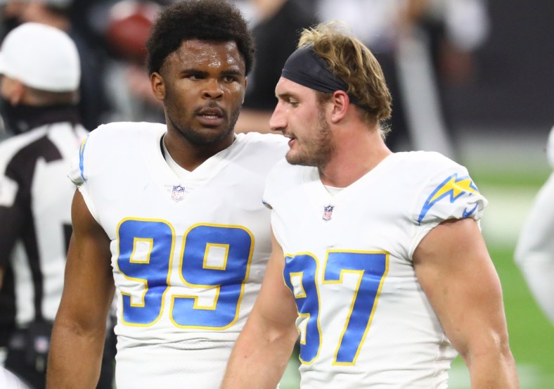 Dec 17, 2020; Paradise, Nevada, USA; Los Angeles Chargers defensive end Joey Bosa (97) and defensive tackle Jerry Tillery (99) against the Las Vegas Raiders at Allegiant Stadium. Mandatory Credit: Mark J. Rebilas-USA TODAY Sports