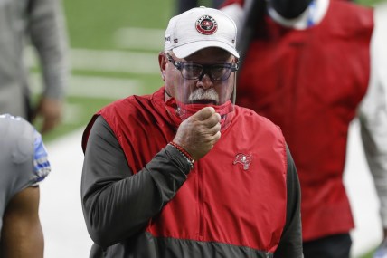 Dec 26, 2020; Detroit, Michigan, USA; Tampa Bay Buccaneers head coach Bruce Arians pulls his mask up while walking off the field after the game against the Detroit Lions at Ford Field. Mandatory Credit: Raj Mehta-USA TODAY Sports